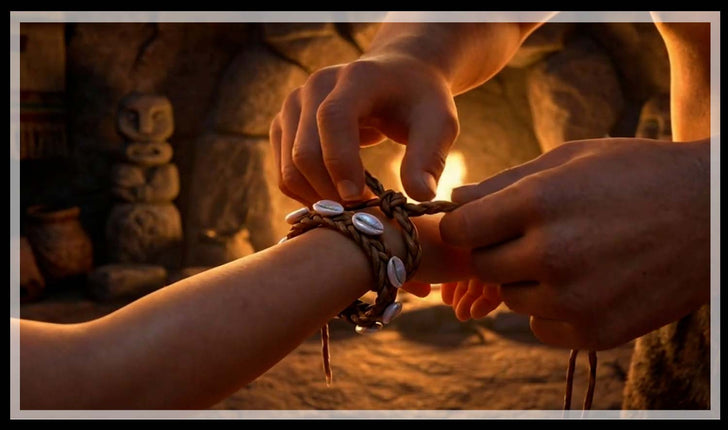 Shell bracelet tied on a wrist by firelight, and shell, gold and leather bracelets on display, bracelet history