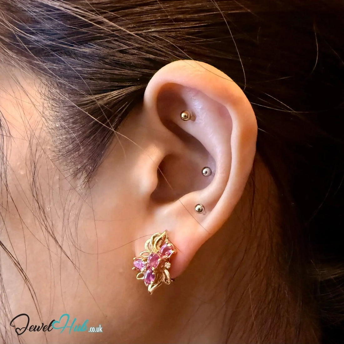 Four oval pink sapphires per earring set at overlapping angles - JewelHub