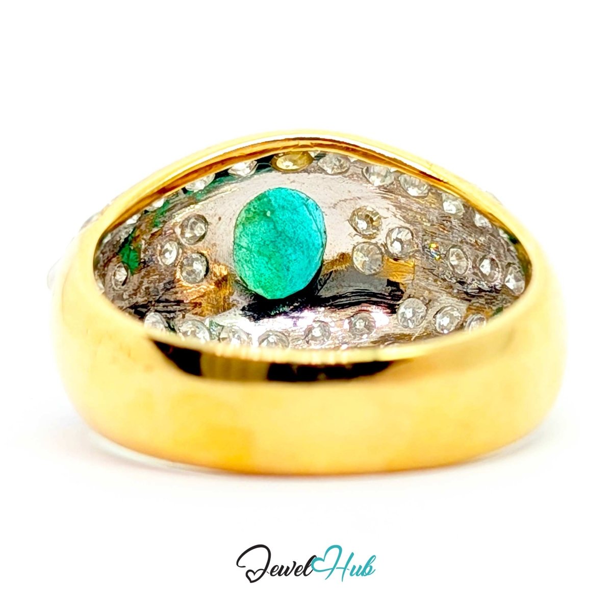 A 14k gold signet ring featuring a central round green turquoise-like gemstone surrounded by a halo of small clear stones on a white background.
