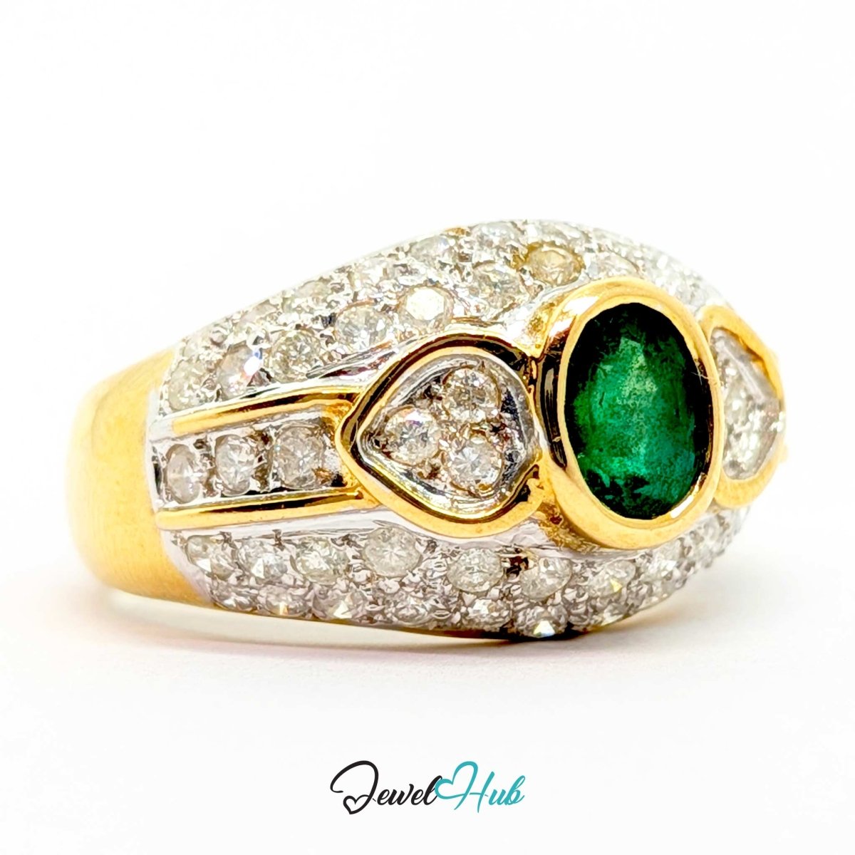 A 14k yellow gold and white gold ring featuring a prominent oval-cut green emerald center stone, surrounded by pavé-set clear stones and a teardrop-shaped green stone, shown on a white background with a 'JewelHub' watermark.