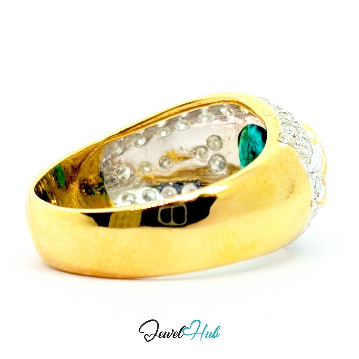 A 14k yellow gold signet ring with a clear crystal pavé band and a round green emerald-cut gemstone on the side, shown on a white background with a 'JewelHub' watermark.