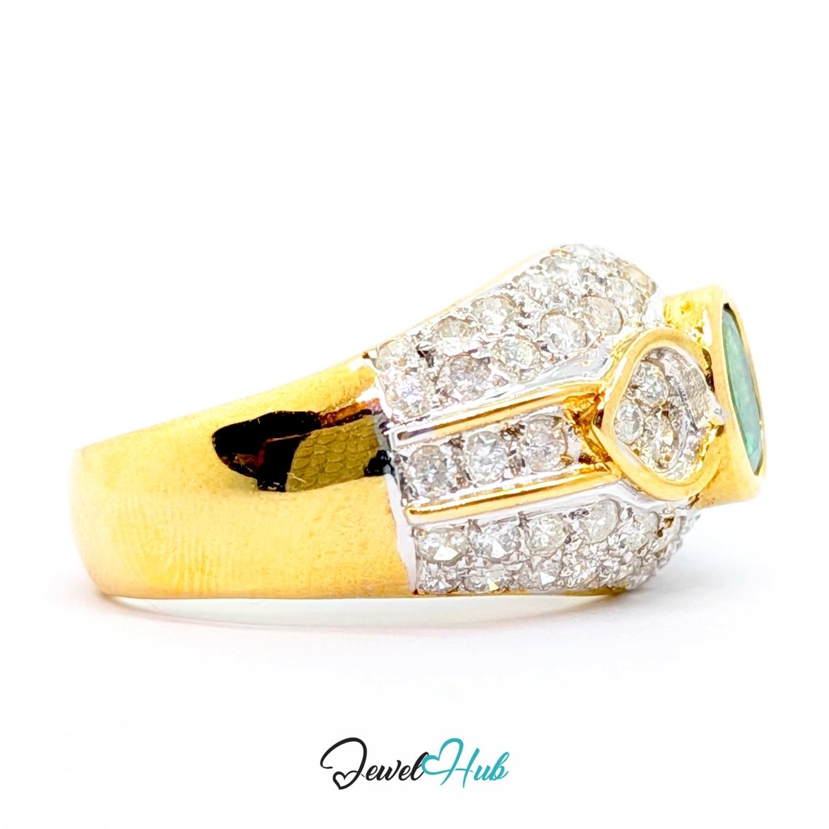 A 14k yellow gold ring with pavé-set clear stones and a central oval-cut light blue stone, shown on a white background with a JewelryHub watermark.