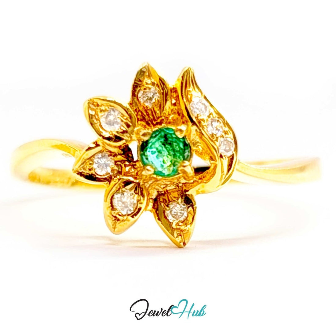 A yellow 14k gold flower-shaped ring featuring a central round green emerald-cut gemstone and multiple small round-cut diamonds set in petal-like shapes, shown on a white background with a JewelHub watermark.