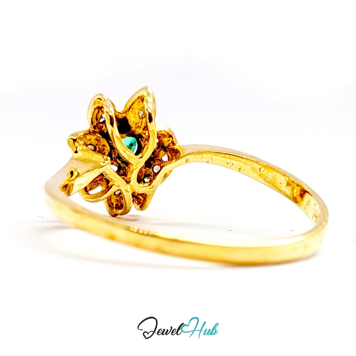 A 14k gold ring featuring a stylized fox head design with a small turquoise-colored gemstone in the center, set against a plain white background with a 'JewelHub' watermark at the bottom.