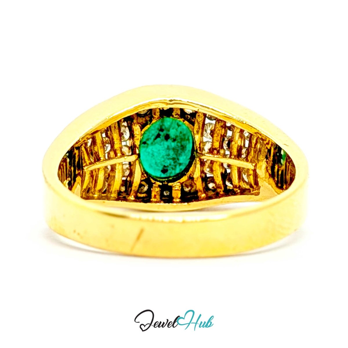 A gold-colored triangular 14k ring featuring a central oval green stone and small clear stones along the inner band, shown on a white background with a JewelryHub watermark.