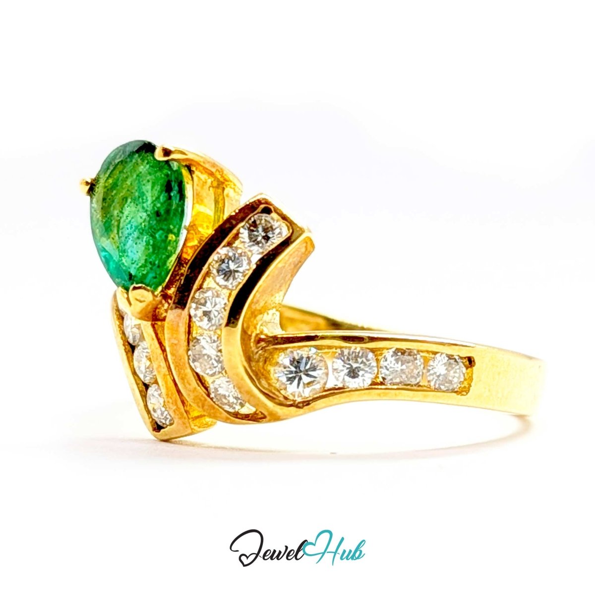 A yellow 14k gold ring featuring a large oval green emerald-cut center stone and a curved shank paved with small clear stones, shown on a white background with a JewelHub watermark.