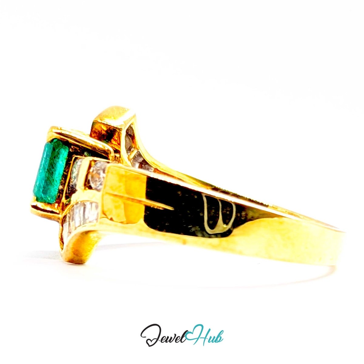 A 14k yellow gold ring featuring a rectangular green emerald-cut center stone and small clear accent stones on the shoulders, shown on a white background with a JewelHub watermark.