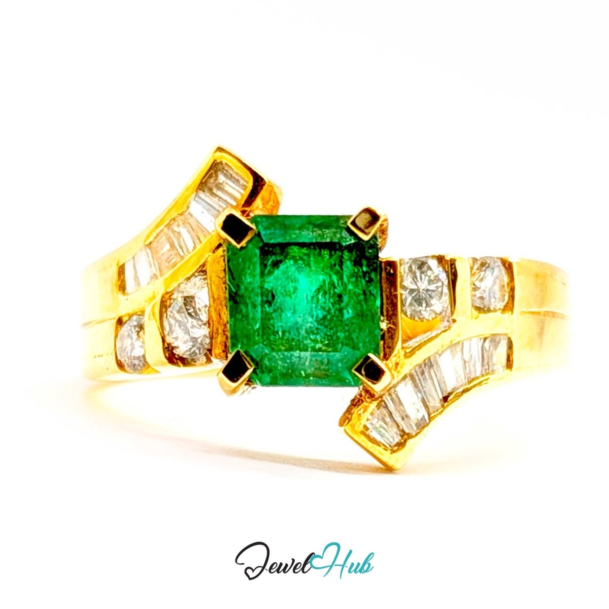 A 14k yellow gold ring featuring a rectangular emerald-cut green gemstone in the center, flanked by curved diamond channel-set accents on a white background with a JewelHub watermark.