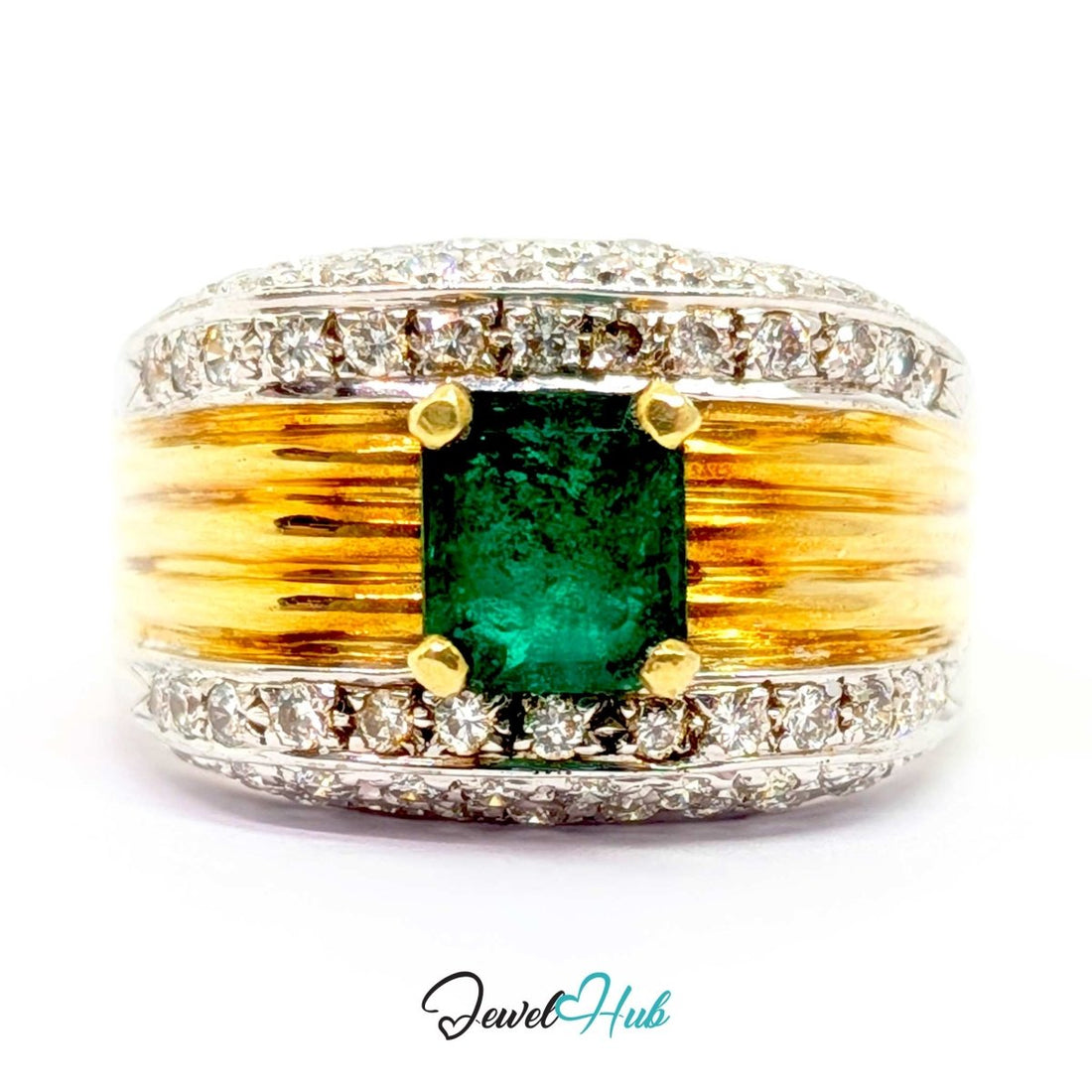 A wide 14k gold and silver band ring featuring a central green emerald-cut gemstone, surrounded by small clear stones along the top and bottom, with textured gold bars on either side of the center stone. The ring is photographed on a white background with a 'JewelHub' watermark at the bottom.
