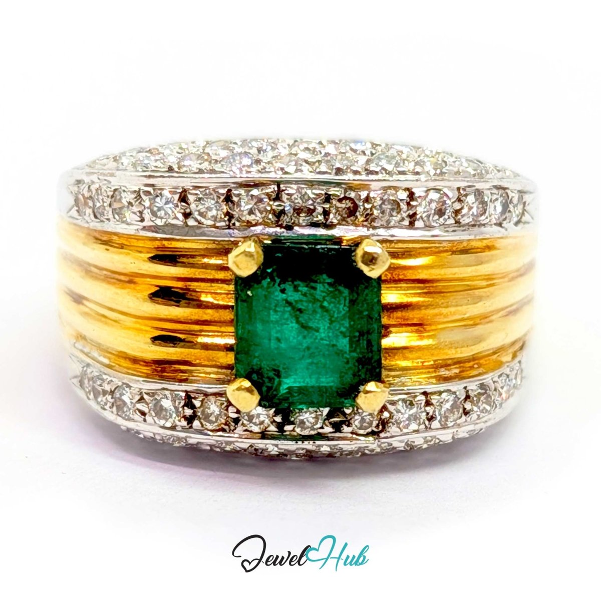 A yellow 14k gold and silver-tone ring featuring a rectangular green emerald-cut center stone, surrounded by small clear stones and textured gold bands, shown on a white background with a JewelryHub watermark.