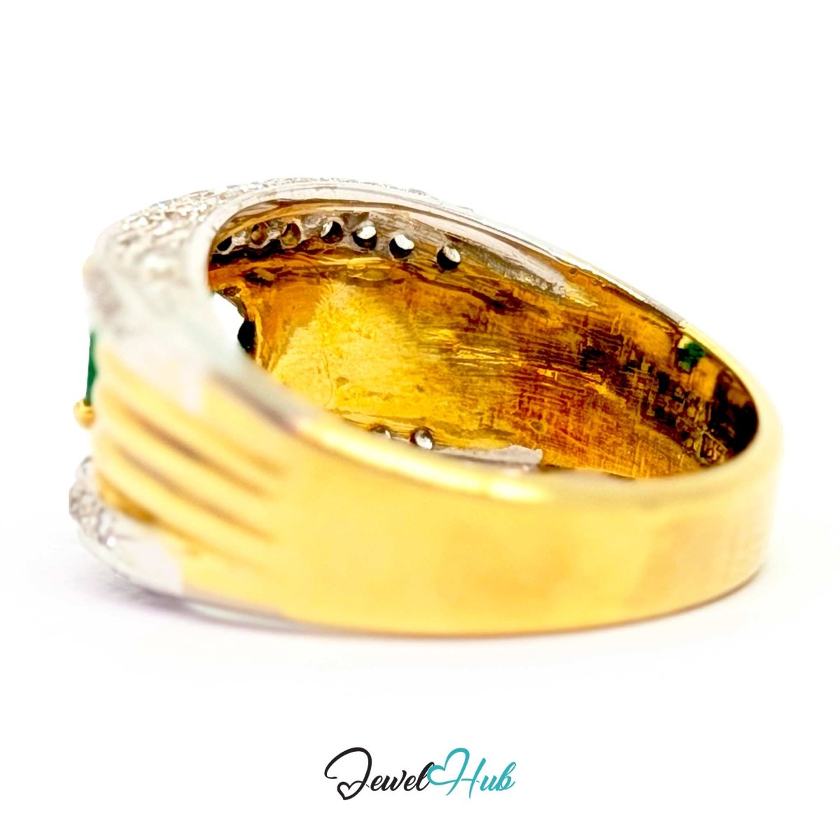 A close-up of a vintage 14k gold ring with a silver-toned textured band, featuring a small green stone on the side and tiny clear stones along the top, shown on a white background with a 'JewelHub' watermark.