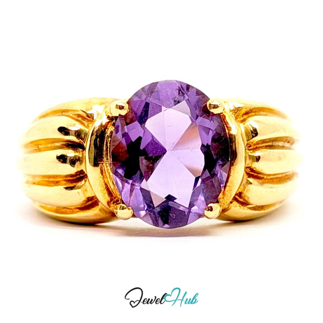 A yellow 14k gold ring featuring a large oval-cut purple amethyst gemstone in a prong setting, with a textured, ribbed gold band. The ring is photographed on a clean white background with a 'JewelHub' watermark at the bottom.
