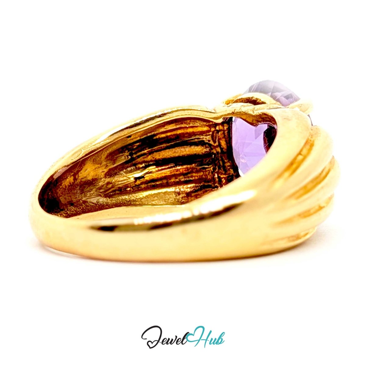 A 14k gold ring with a textured, ribbed band and a small light purple gemstone, shown on a white background with a 'JewelHub' watermark at the bottom.