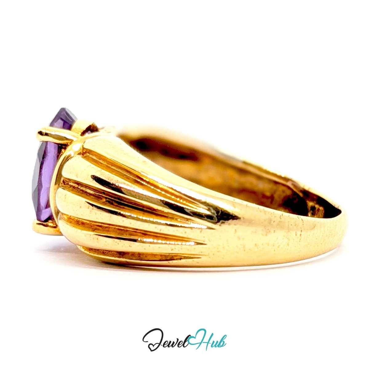 A 14k gold ring with a faceted purple gemstone, shown in a side profile on a white background with a 'JewelHub' watermark at the bottom.
