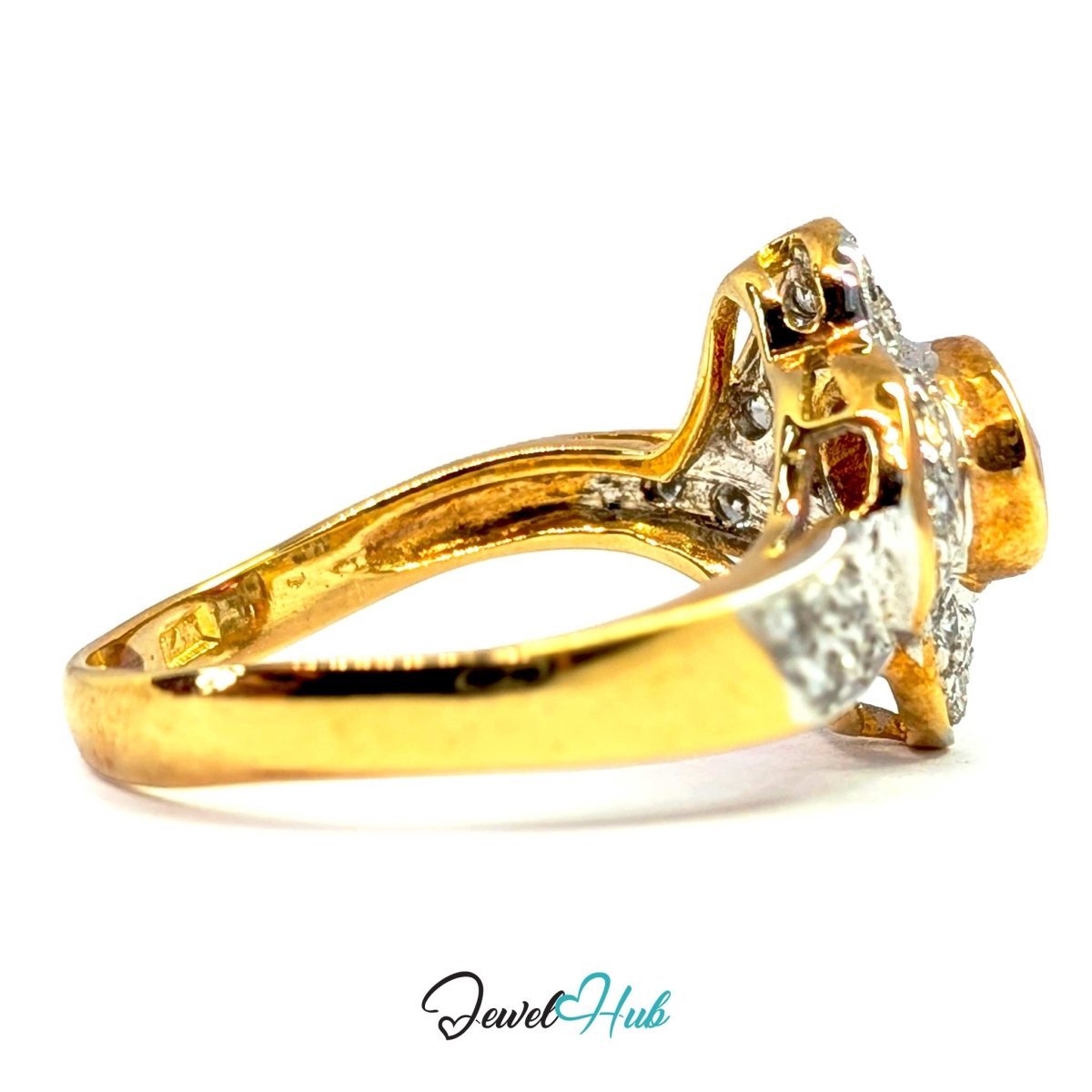 A yellow solid 14k gold ring with a diamond halo setting, shown from a side angle on a white background with a 'JewelHub' watermark at the bottom.
