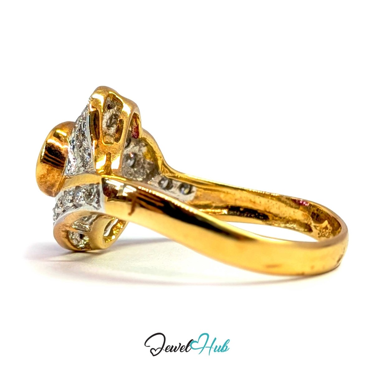 A solid 14k gold ring with a cluster setting featuring small clear stones, shown on a white background with a 'JewelHub' watermark at the bottom.