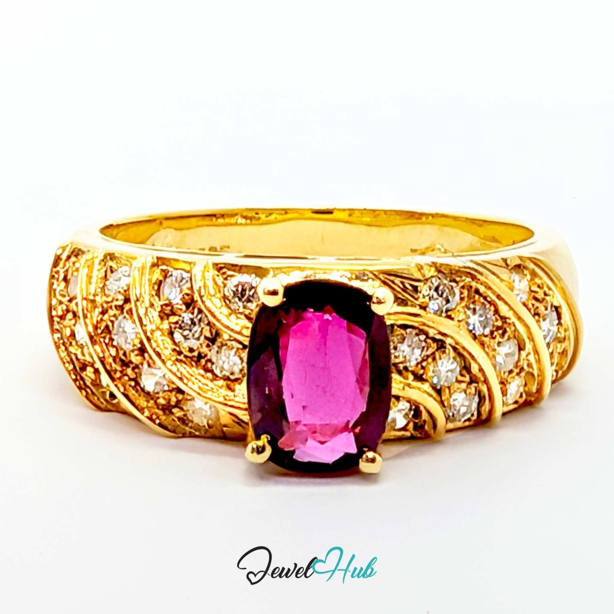 A yellow 14k gold ring featuring a large rectangular pink gemstone in the center, surrounded by small clear stones and intricate gold detailing on a white background.