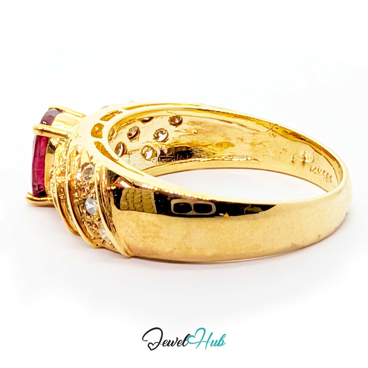 A yellow 14k gold ring featuring a rectangular pinkish-red gemstone and small clear accent stones, shown on a white background with a 'JewelHub' watermark at the bottom.