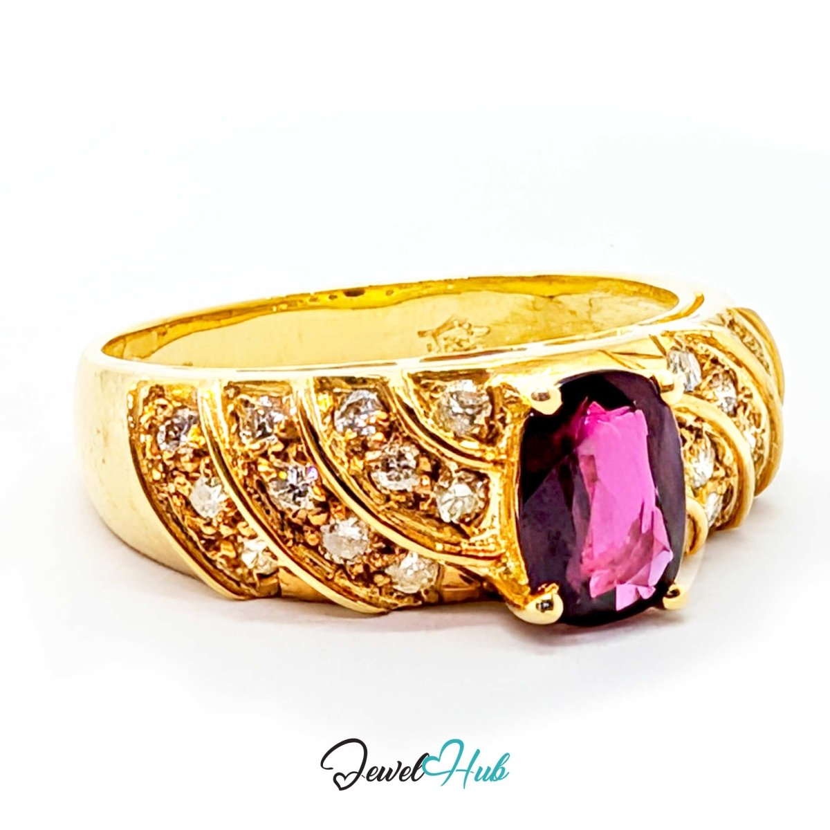 A yellow 14k gold ring featuring a large, cushion-cut pink gemstone in a prong setting, accented with rows of small clear round-cut stones. The ring is photographed on a clean white background with a 'JewelHub' watermark at the bottom.