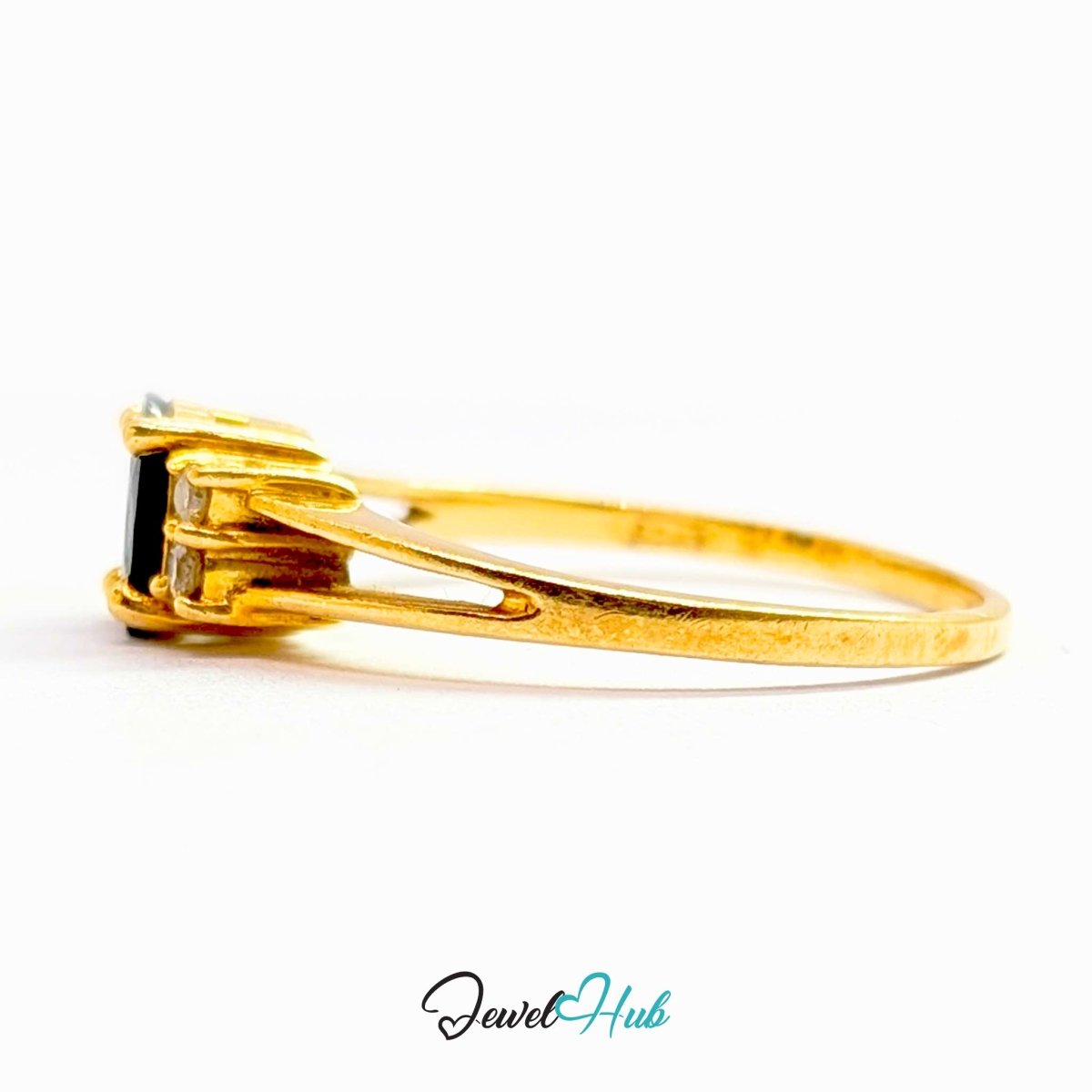 A 14k yellow gold ring with a rectangular black gemstone and small clear accent stones, shown in a side profile on a white background with a 'JewelHub' watermark.