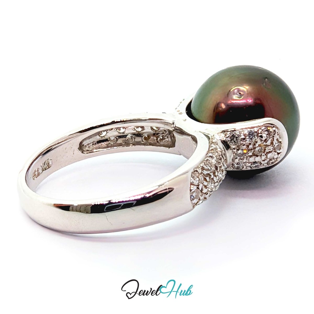 18k white gold featuring a large, round, iridescent dark green pearl accented by small clear pavé diamonds on the shank, shown on a white background with a 'JewelHub' watermark.