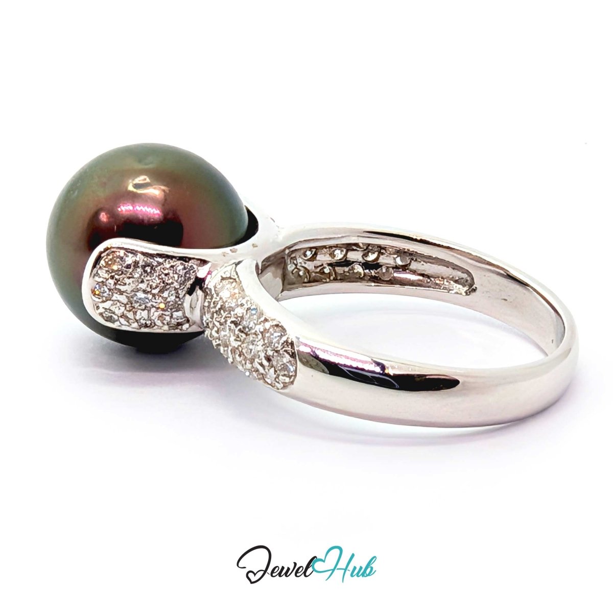 18k white gold featuring a large, round, dark green-black pearl and pavé-set clear stones, shown on a white background with a 'JewelHub' watermark.