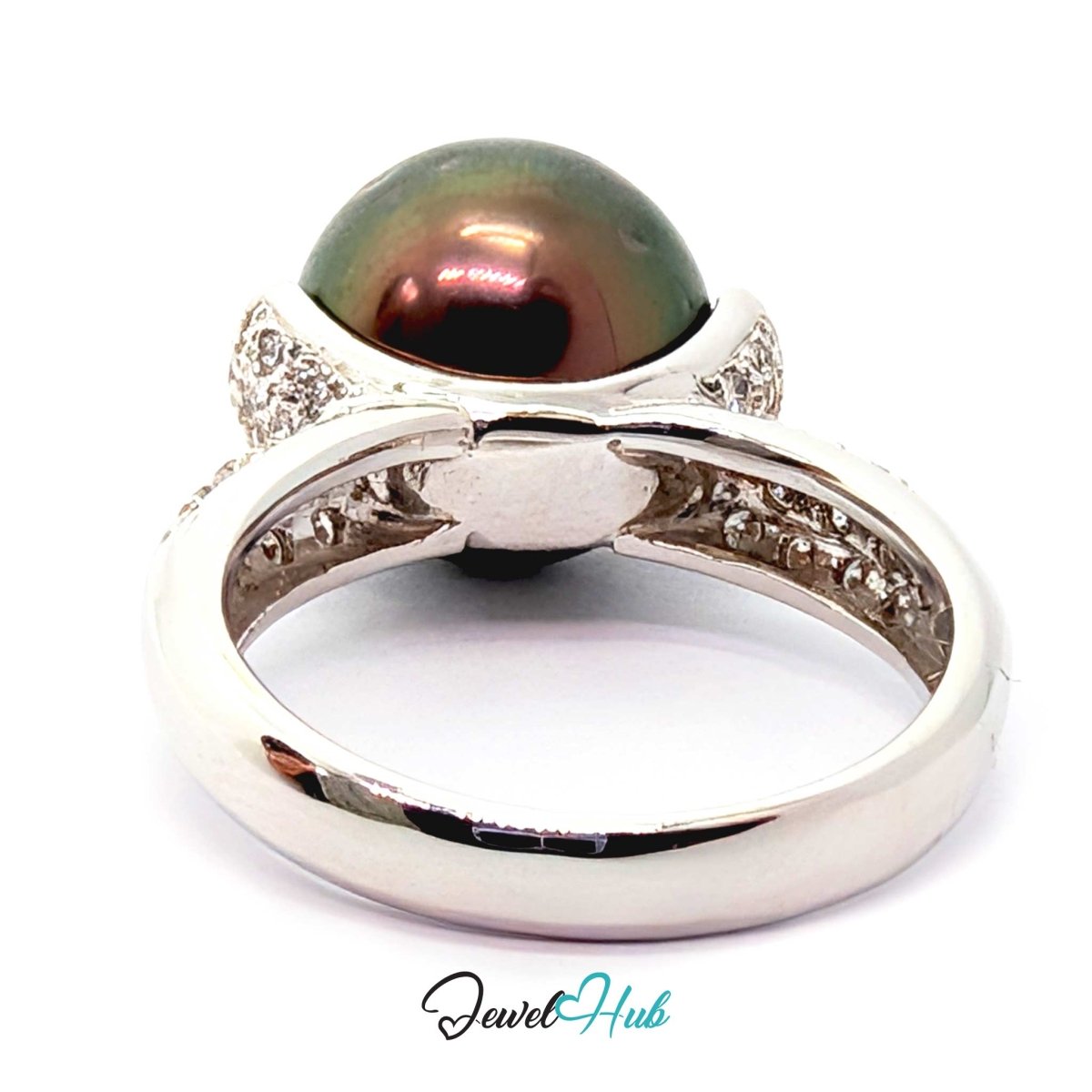 18k white gold ring featuring a large oval dark green-black pearl with a pinkish iridescent sheen, accented by small clear stones on the shoulders, shown on a white background with a JewelHub watermark.
