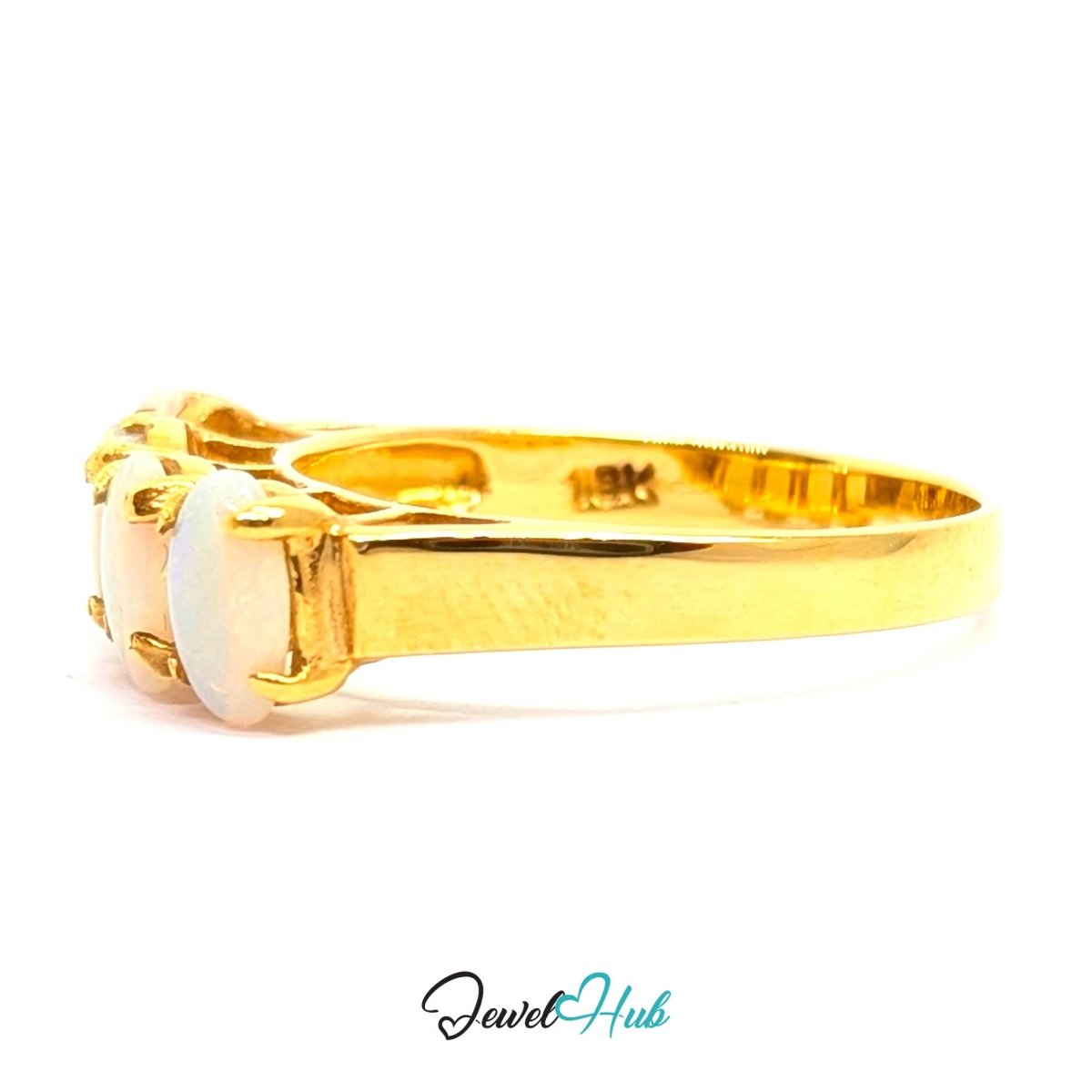 A 18k yellow gold ring with a white opal gemstone, shown from a side profile on a white background with a 'JewelHub' watermark at the bottom.
