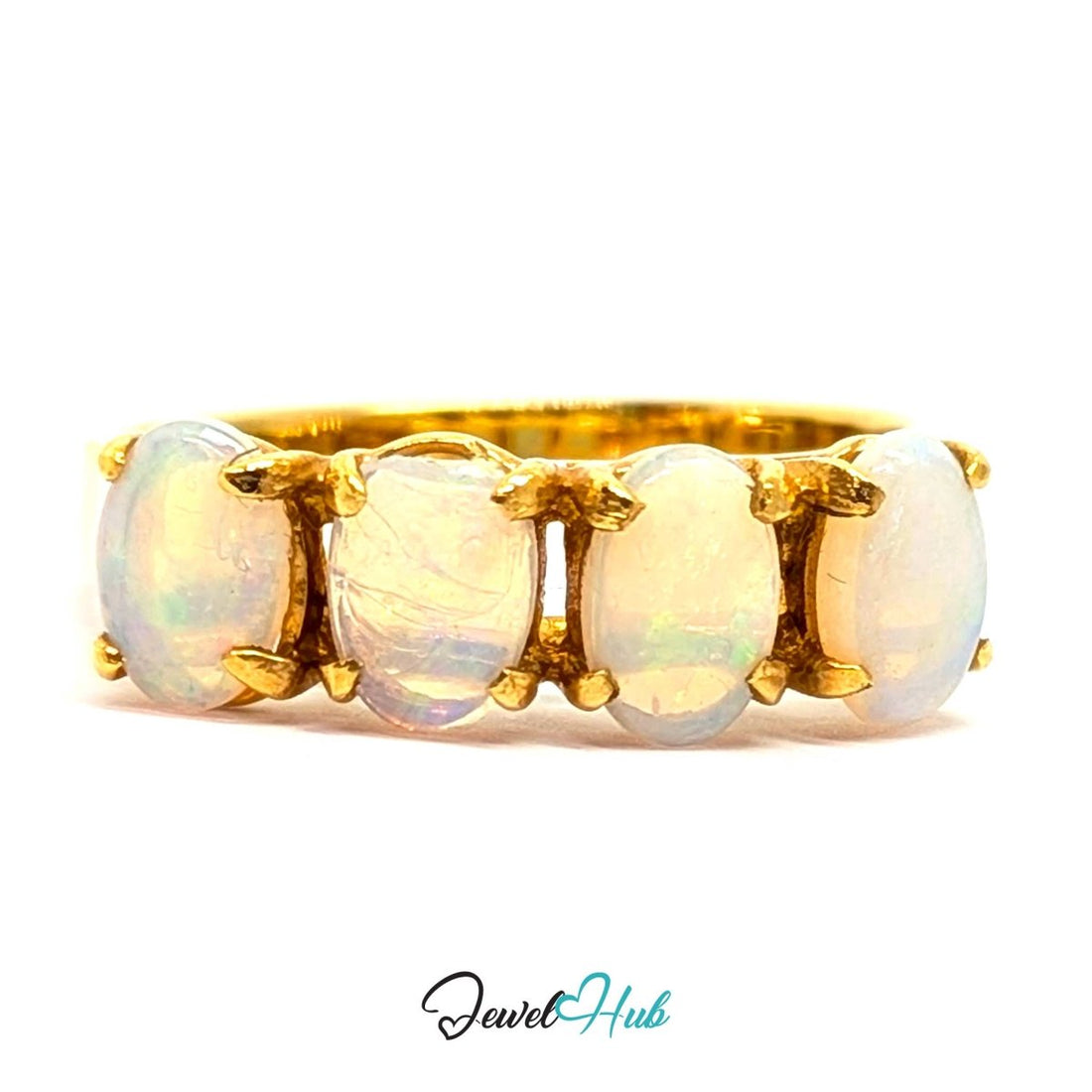 A 18k yellow gold ring featuring five oval-cut white opal gemstones set in a row, shown against a plain white background with a 'JewelHub' watermark at the bottom.
