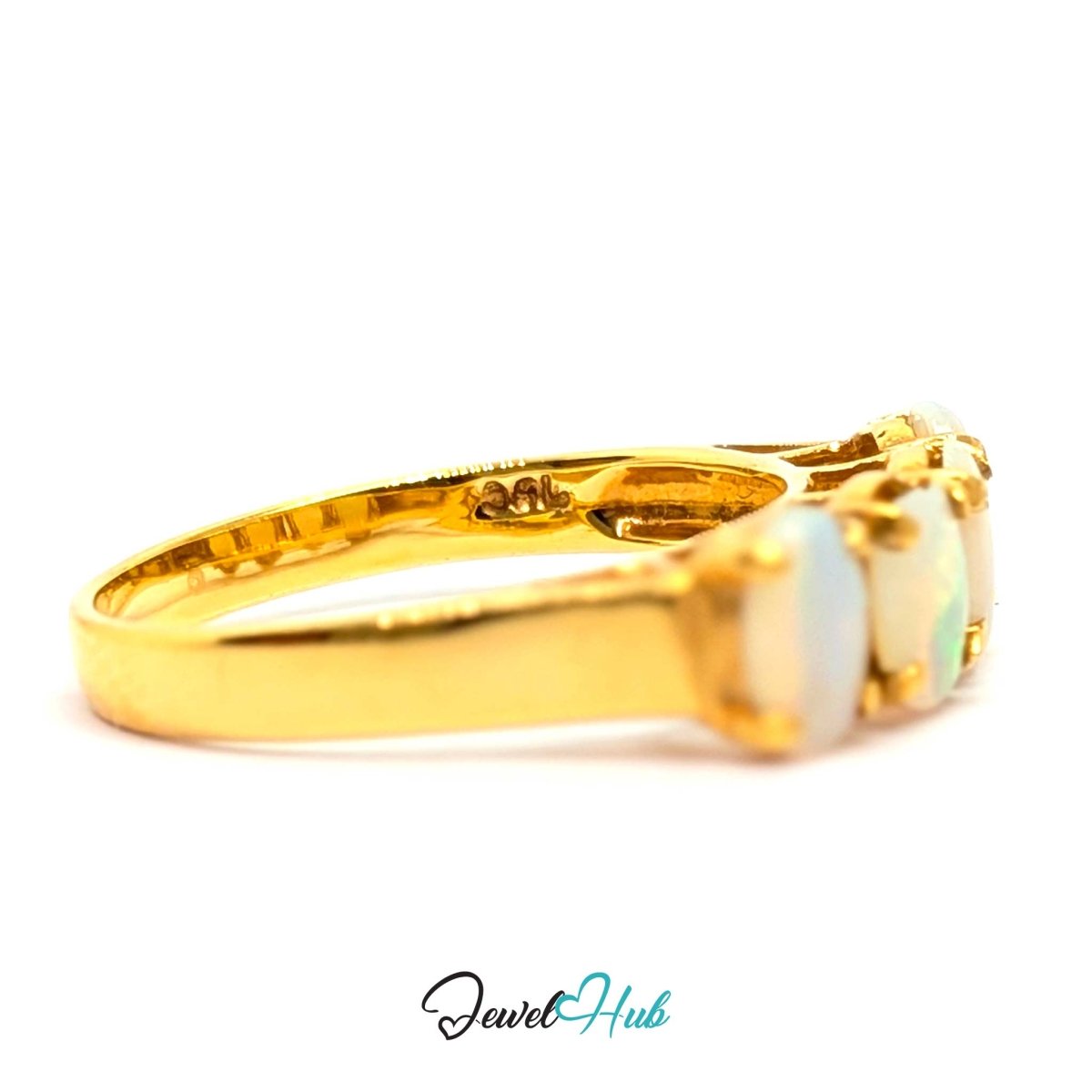 A yellow 18k gold ring featuring three oval-cut white opal gemstones, shown in a side profile view on a white background with a 'JewelHub' watermark at the bottom.