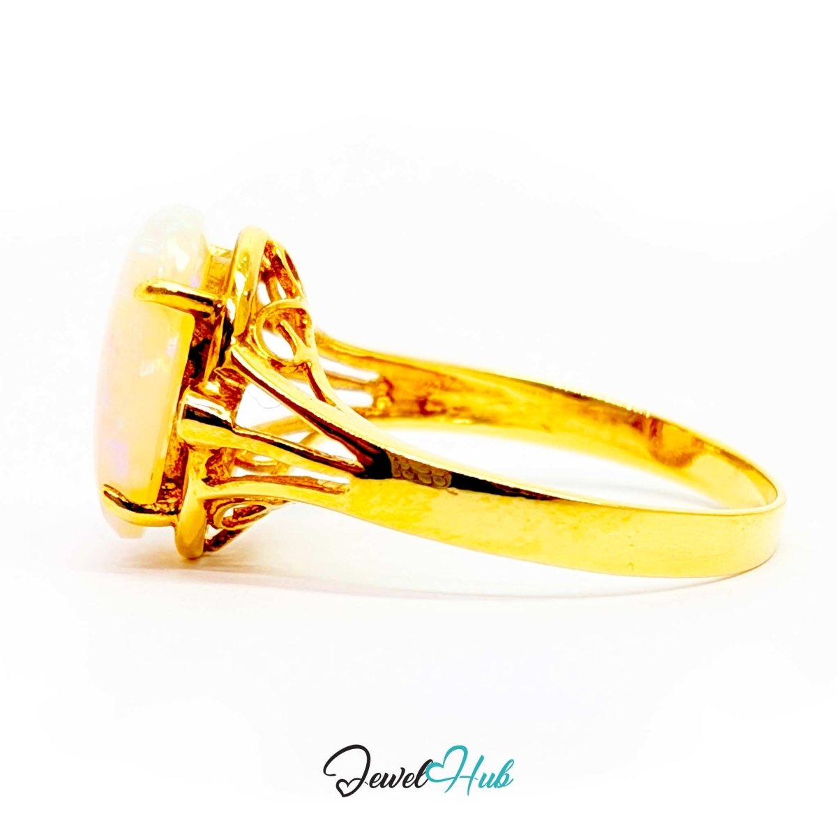 A 18k yellow gold ring with a large oval iridescent opal gemstone, shown in a side profile view on a white background with a 'JewelHub' watermark at the bottom.