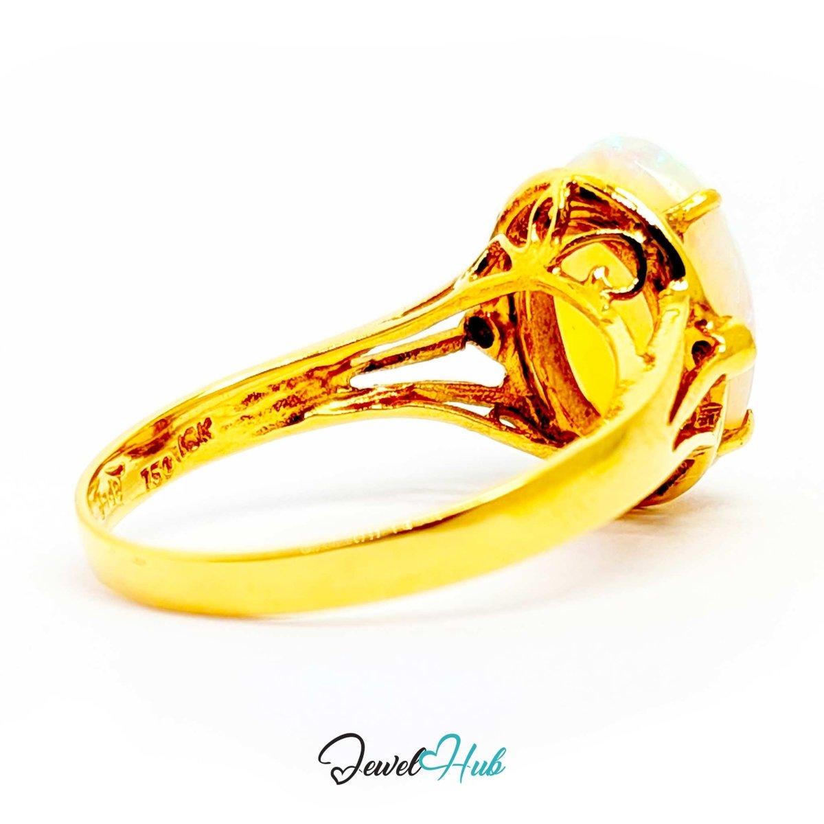 A 18k yellow gold ring featuring a large, oval-shaped white opal gemstone in a prong setting, shown on a clean white background with a 'JewelHub' watermark at the bottom.