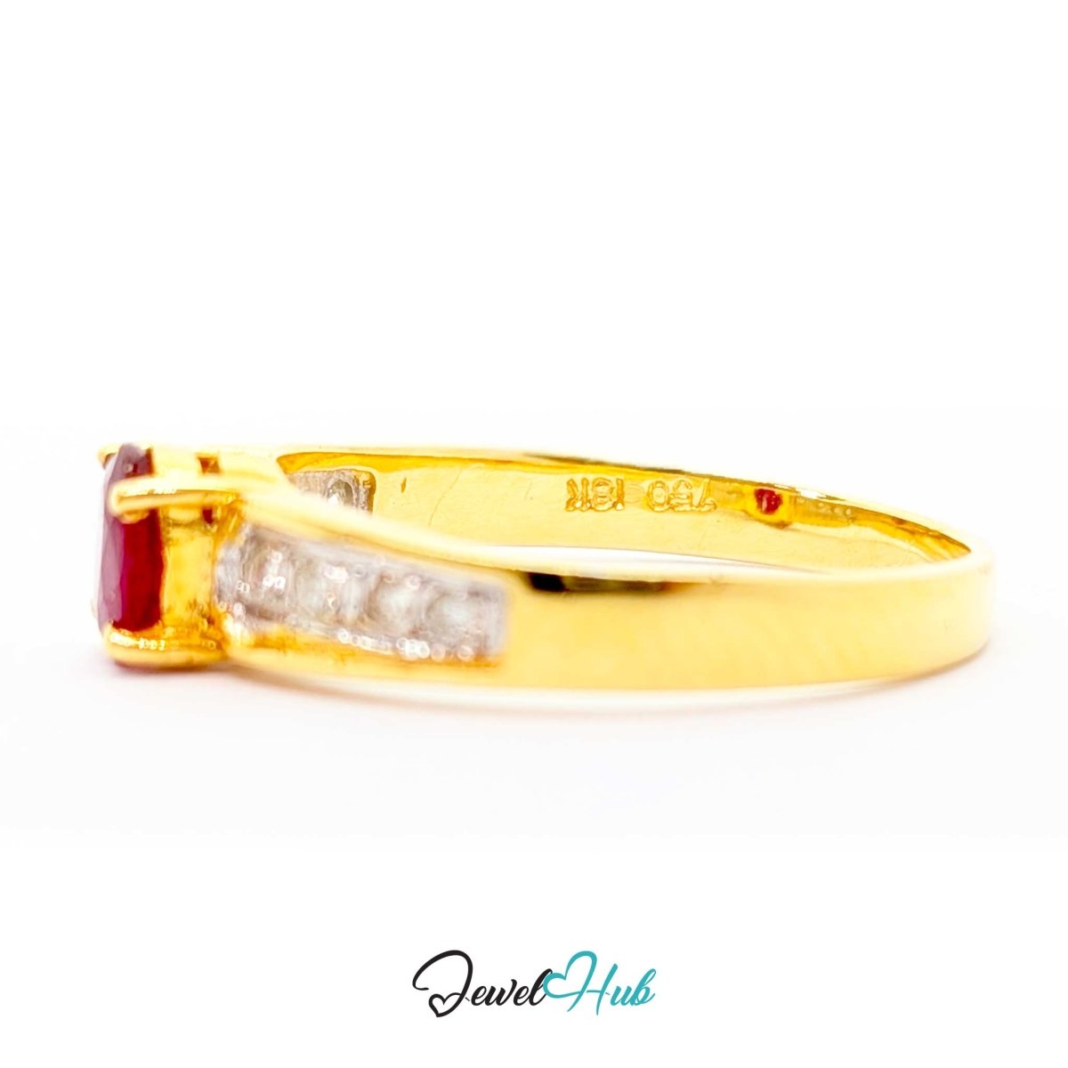 A yellow 14k gold ring featuring a rectangular red gemstone and a channel-set row of clear stones on the band, shown against a plain white background with a 'JewelHub' watermark at the bottom.