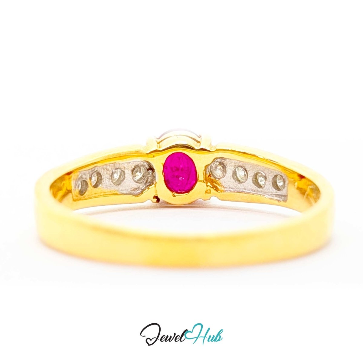 A yellow 14k gold ring featuring a central oval pink gemstone flanked by rows of small clear stones on a silver-toned inlay, shown on a white background with a JewelHub watermark.