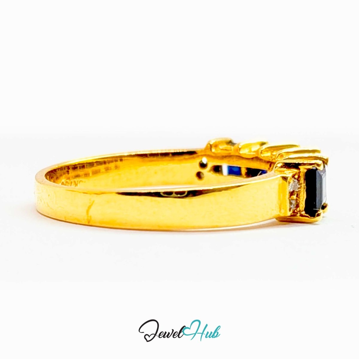 A gold 18k ring with a rectangular black gemstone, shown in profile against a white background with a 'JewelHub' watermark at the bottom.