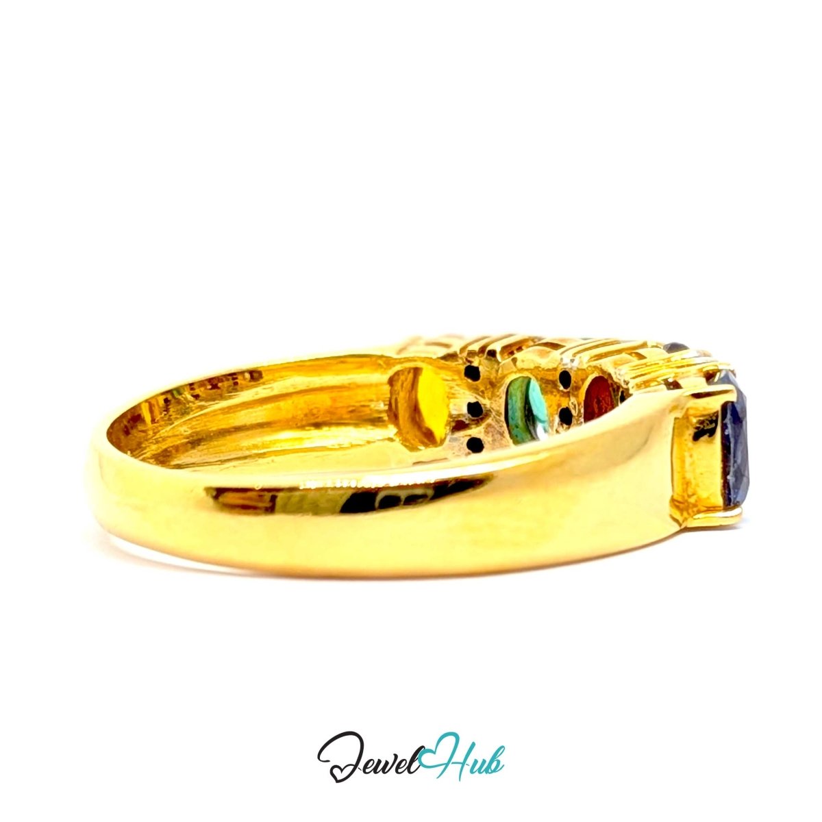 A 18k gold ring with multiple colorful gemstones, shown in profile on a white background with a 'JewelHub' watermark at the bottom.