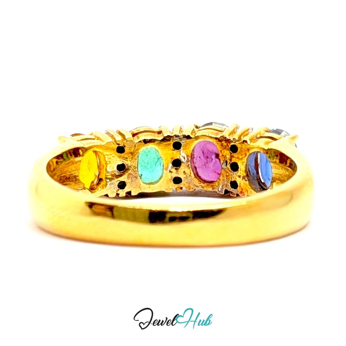 A 18k gold band ring featuring five colorful oval gemstones in yellow, turquoise, pink, blue, and purple, set against a plain white background with a 'JewelHub' watermark at the bottom.