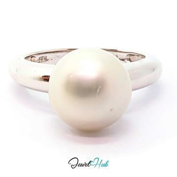 A classic round natural pearl ring set in a polished white gold band, shown against a plain white background with a 'JewelHub' watermark at the bottom.