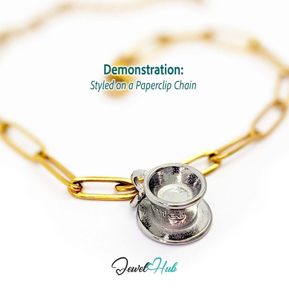 Three-dimensional coffee cup and saucer charm in silver stainless steel - styled on a gold paperclip chain bracelet - JewelHub