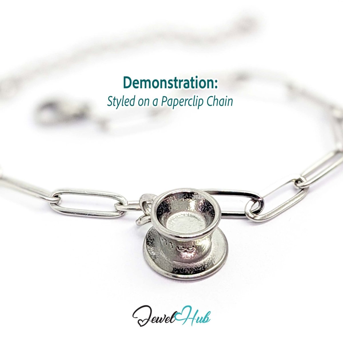 Three-dimensional coffee cup and saucer charm in silver stainless steel - styled on a silver paperclip chain bracelet - JewelHub