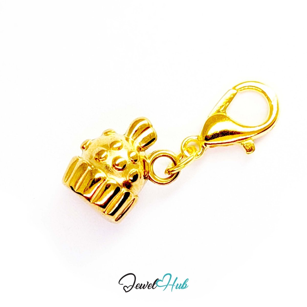Three-dimensional cupcake charm in gold stainless steel - shown with the lobster clasp attached - JewelHub