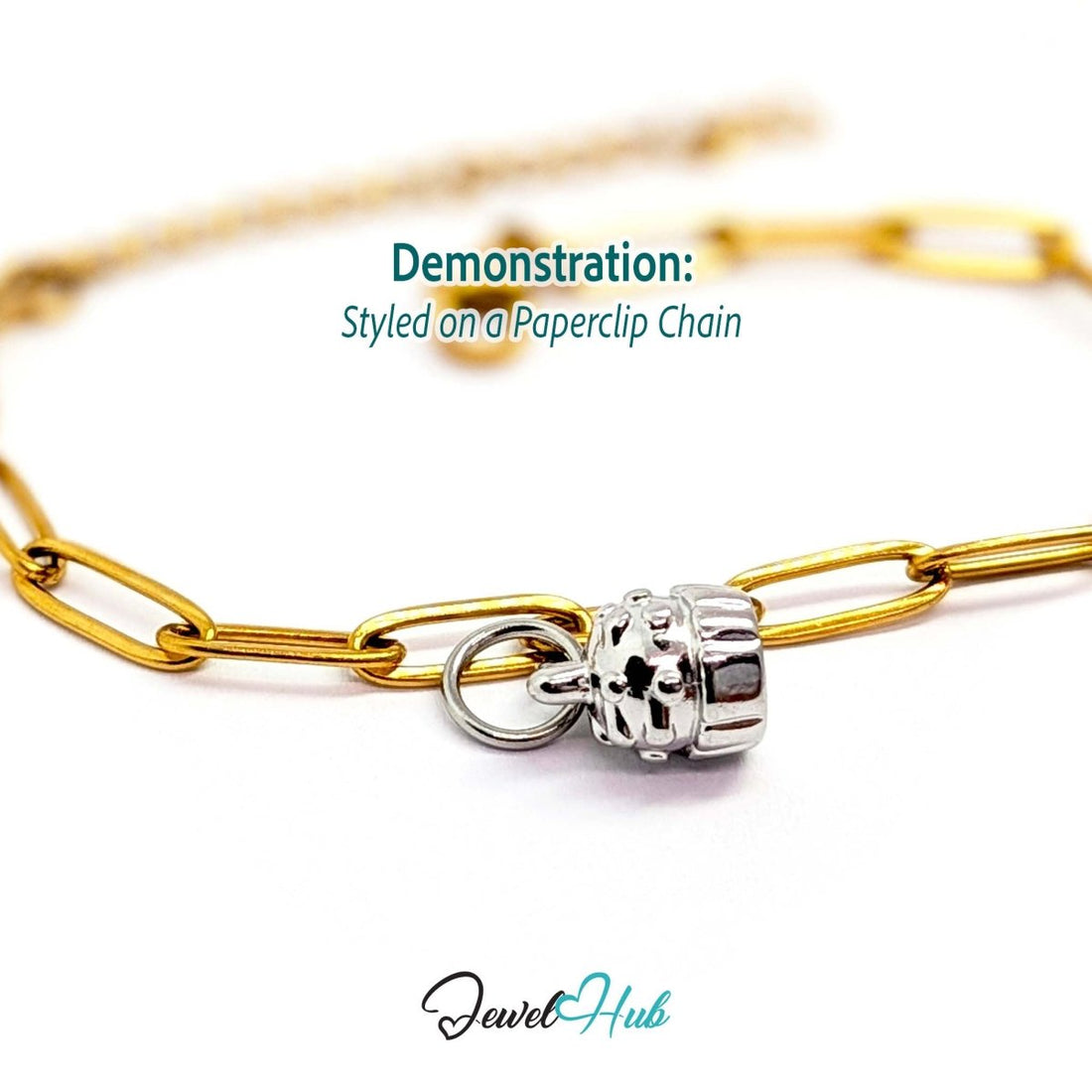 Three-dimensional cupcake charm in silver stainless steel - styled on a gold paperclip chain bracelet - JewelHub