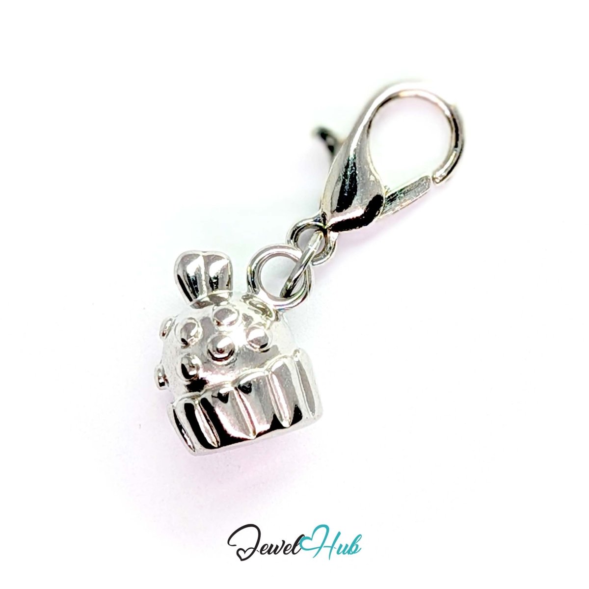 Three-dimensional cupcake charm in silver stainless steel - shown with the lobster clasp attached - JewelHub