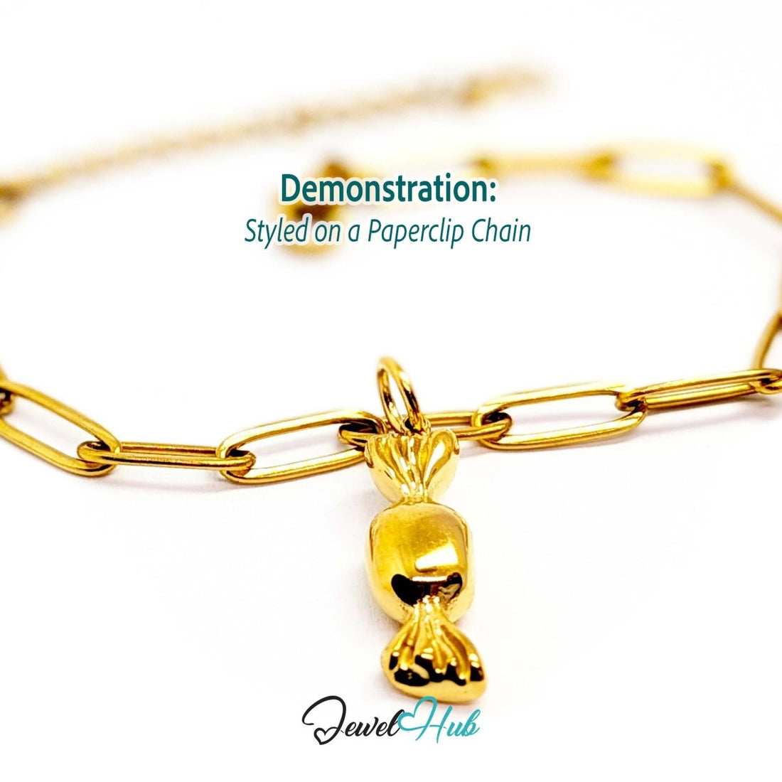 Wrapped sweet charm in gold stainless steel - styled on a gold paperclip chain bracelet - JewelHub
