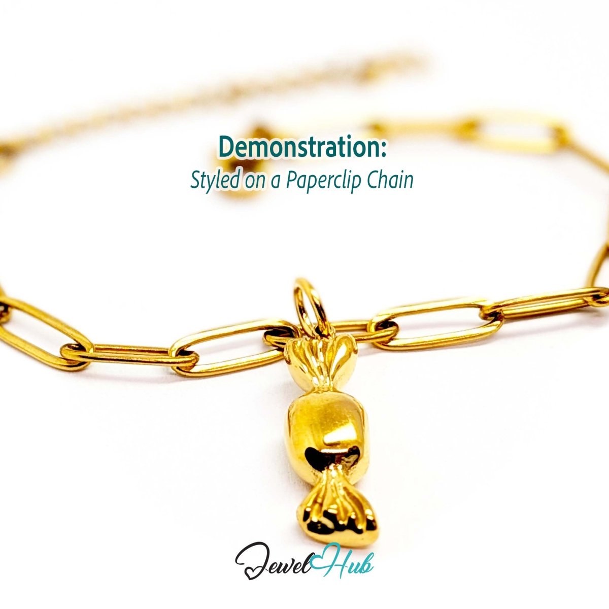Wrapped sweet charm in gold stainless steel - styled on a gold paperclip chain bracelet - JewelHub