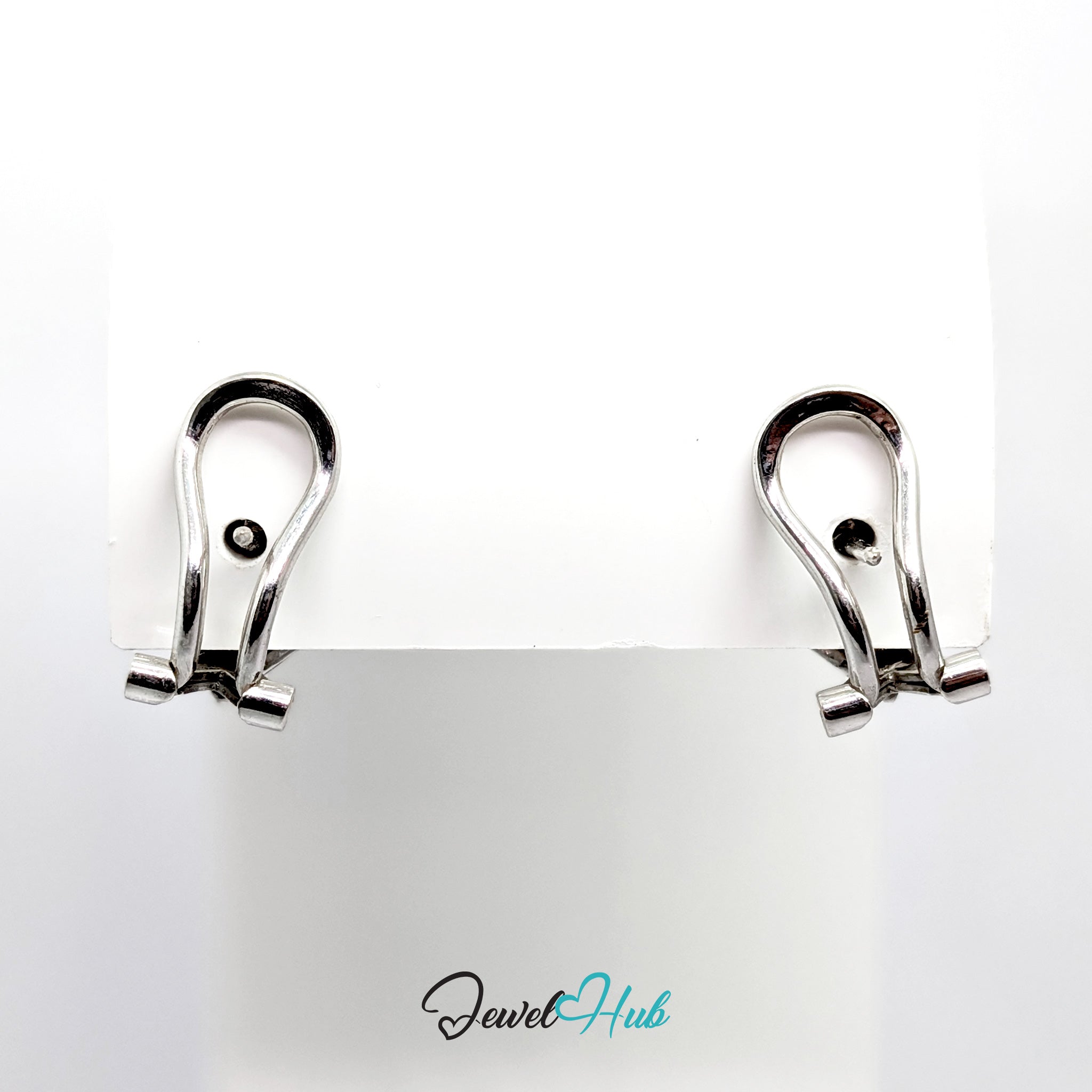 14k white gold checker diamond earrings showing the depth of the plaque and the textured ground between the stones