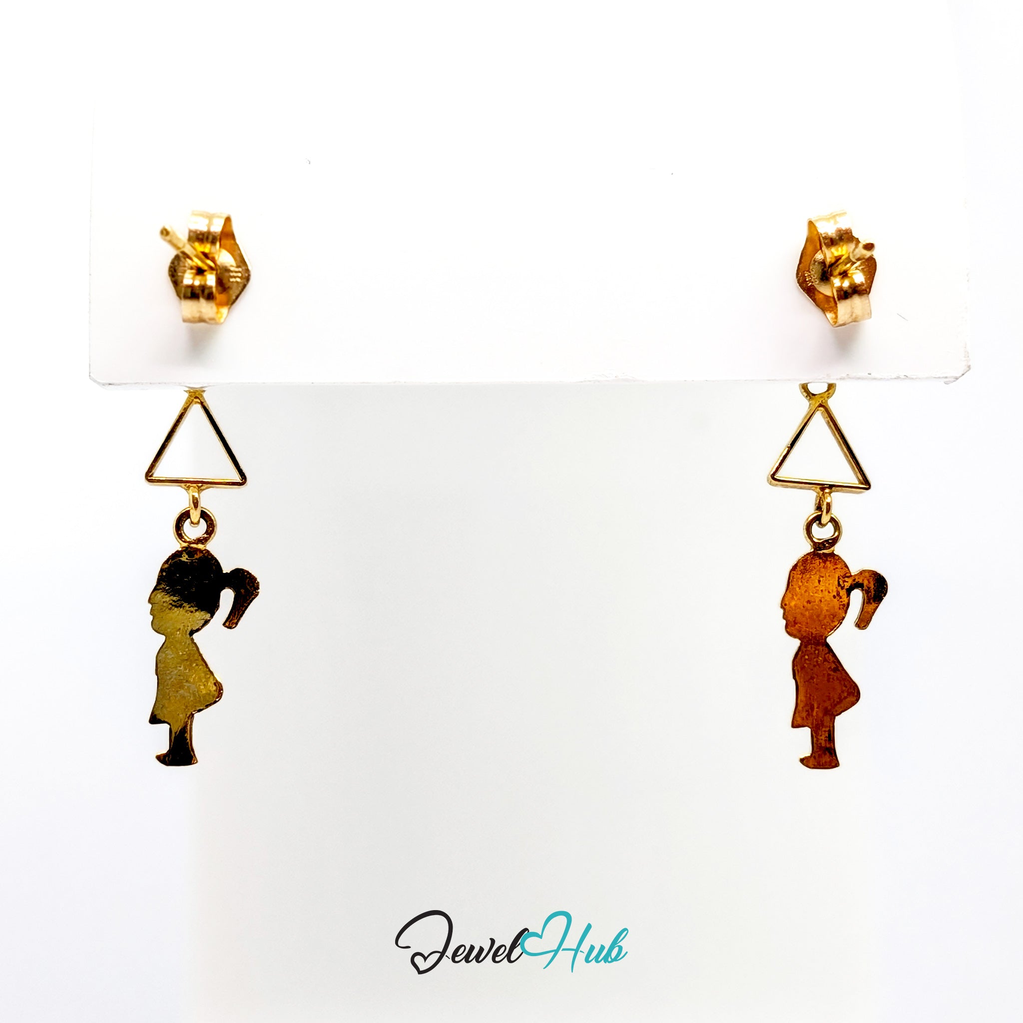 One 14k gold girl silhouette drop earring hanging from the edge of a presentation card