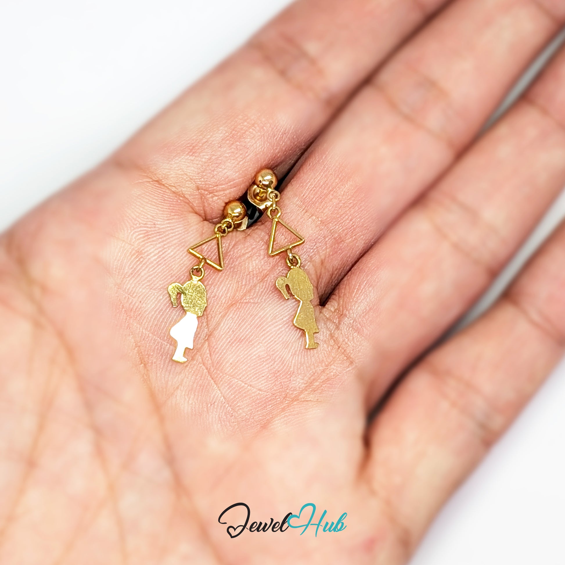 Pair of 14k solid gold girl silhouette earrings on a white presentation card
