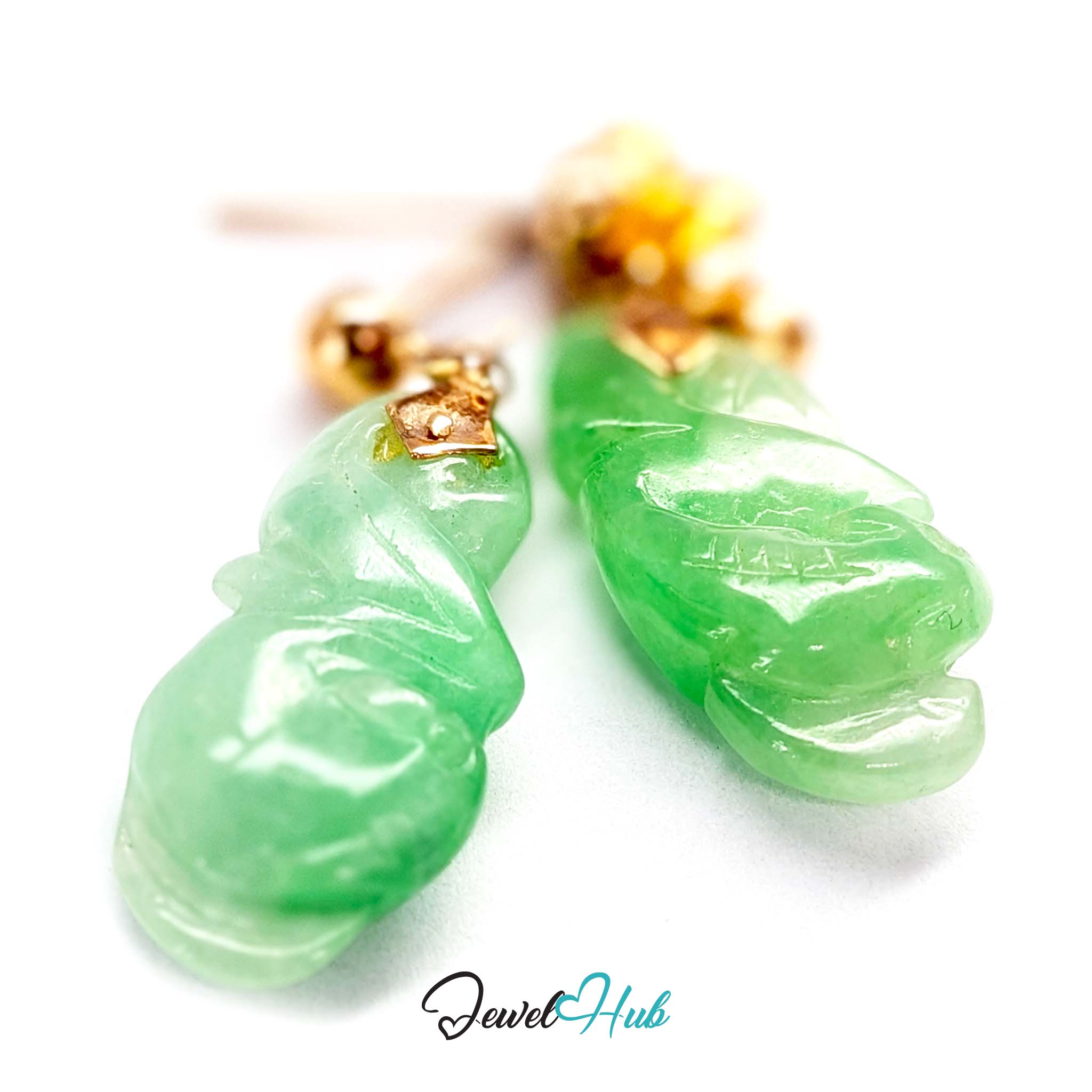 Single jump ring linking the gold ball stud to the carved jade drop - JewelHub