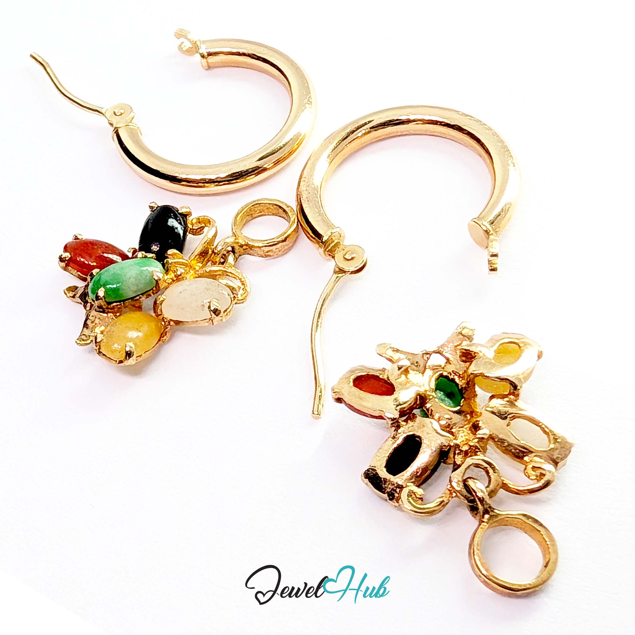 Fine open gold scrollwork holding the five colour jade cluster, reading as a butterfly - JewelHub